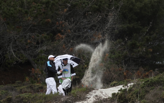 Tom Dundon hits a shot off a sand dune on the fourth hole during the …